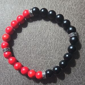 Red Turquiose and Black Onyx Beaded Bracelet With 4 Silver Spacers.